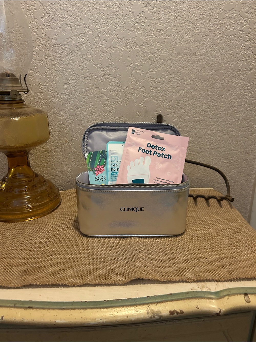 Clinique Silver Cosmetic Travel Pouch with Pink Detox Foot Patch